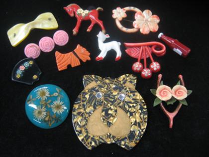 Twelve plastic animal pins   