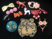 Twelve plastic animal pins