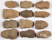 TWELVE PREHISTORIC STONE AXE H