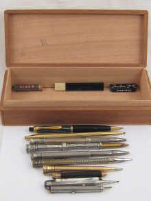 Twelve propelling pencils including