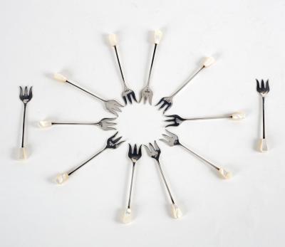 Twelve silver pickle forks, EV,