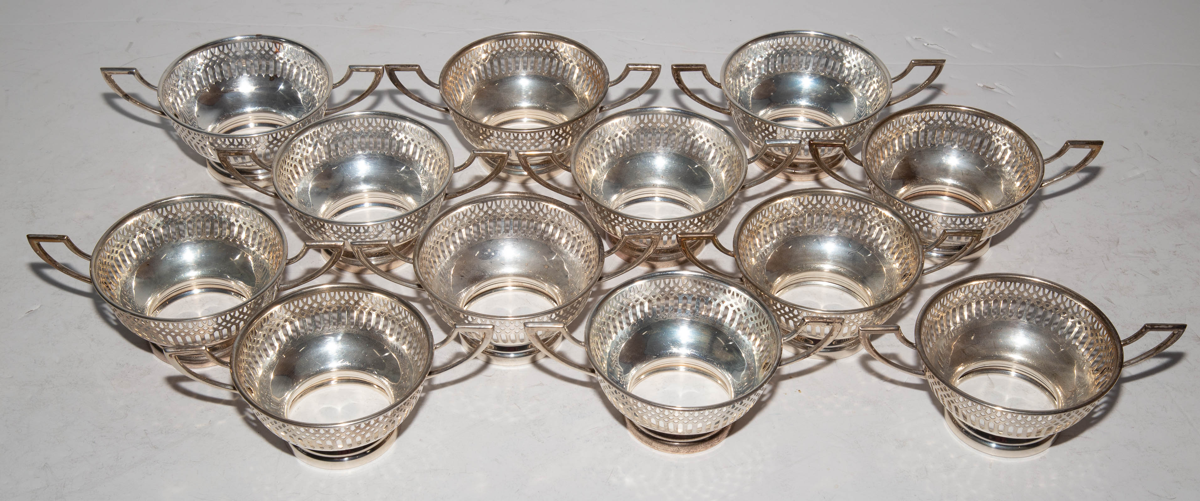 TWELVE STERLING BOUILLON BOWLS