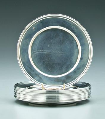 Twelve sterling bread plates: round
