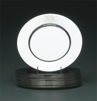 Twelve sterling service plates: