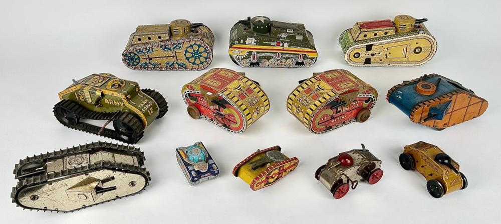 TWELVE TIN WIND-UP TANKS, MOSTLY