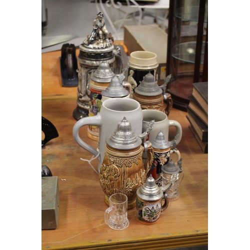 Twelve various beer steins,