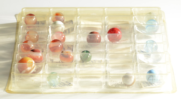 TWENTY COLLECTIBLE MARBLES hand