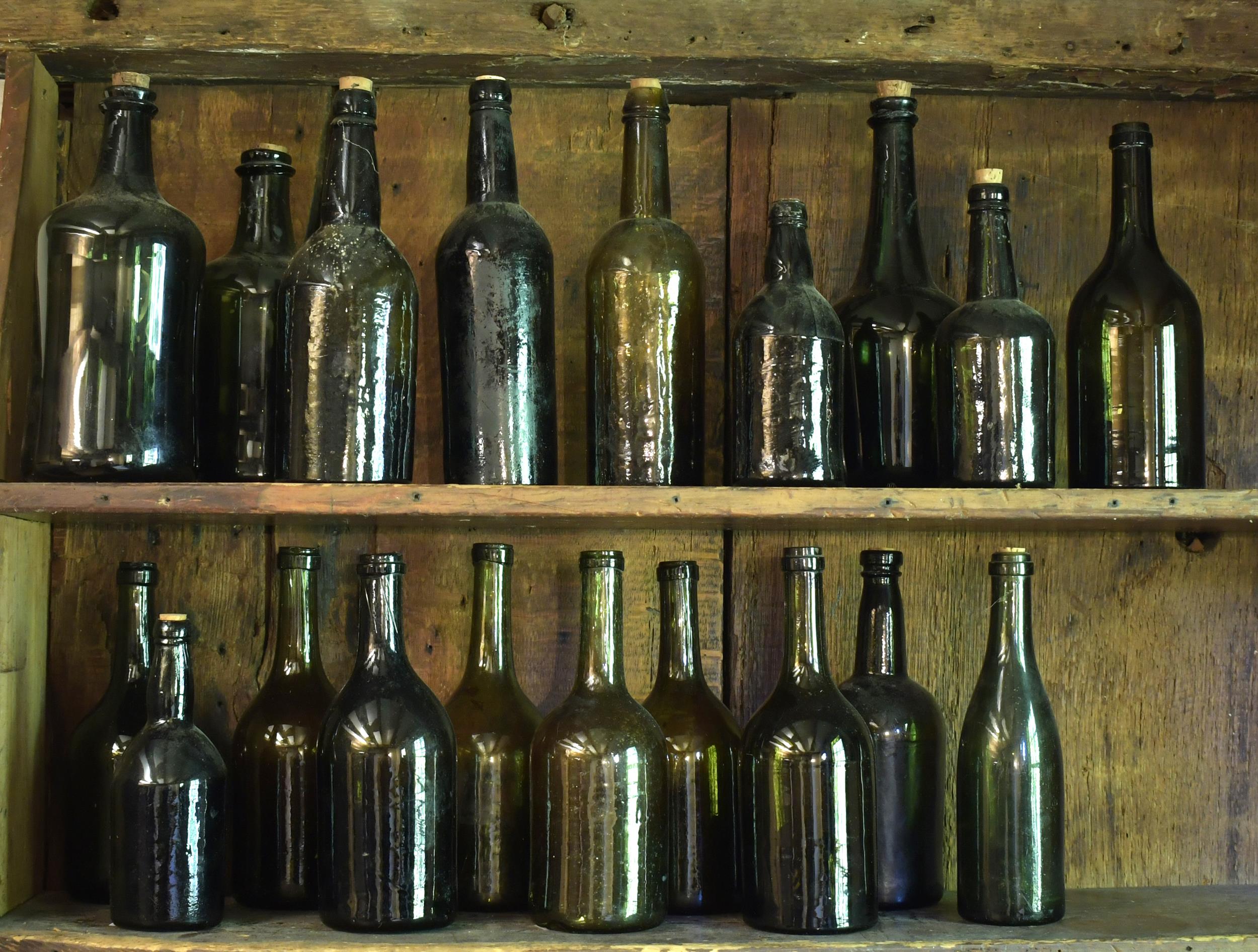 TWENTY EARLY GLASS BOTTLES. 18th
