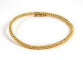 TWENTY-FOUR KARAT YELLOW GOLD
