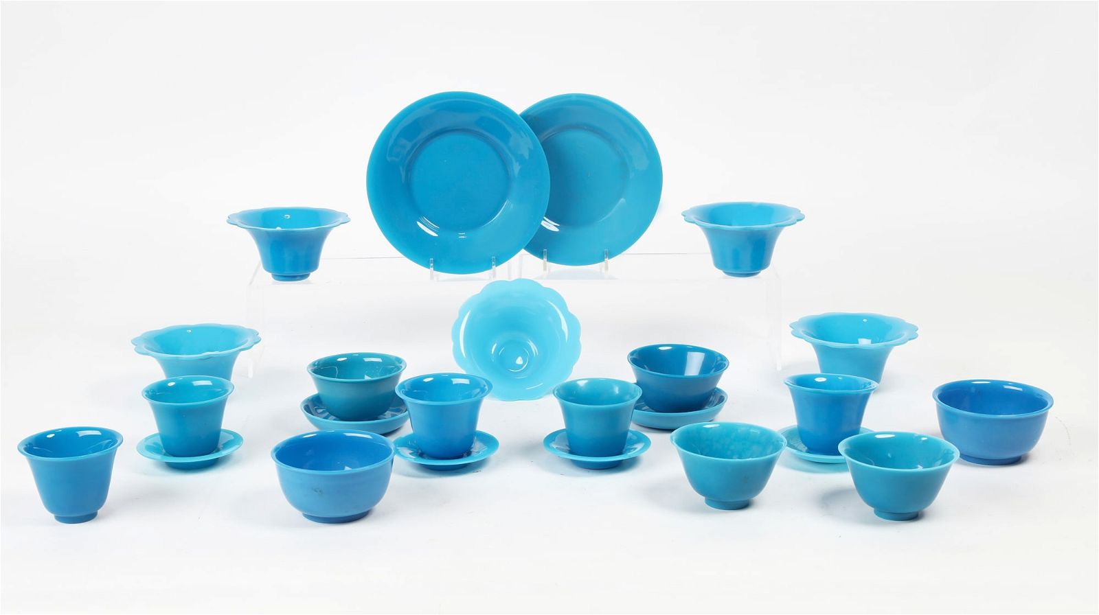 TWENTY FOUR PEKING BLUE GLASS BOWLS