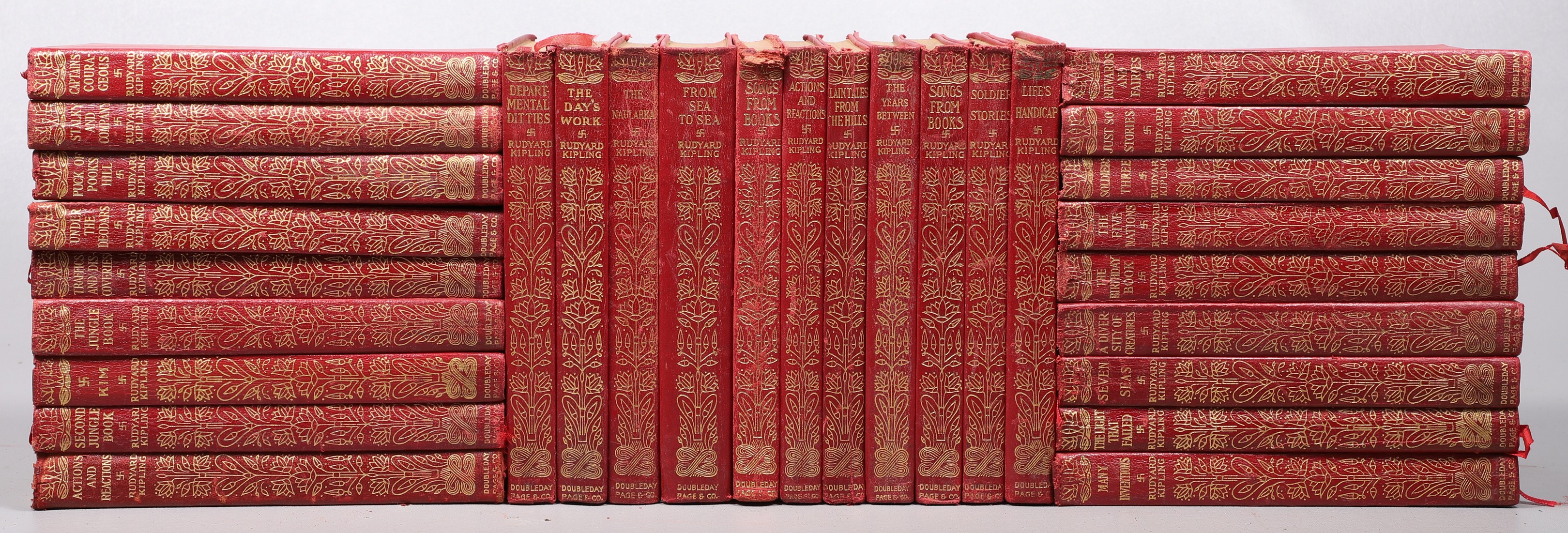 Twenty-nine books with soft red