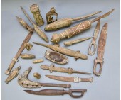 Twenty-one carved Aborigine an