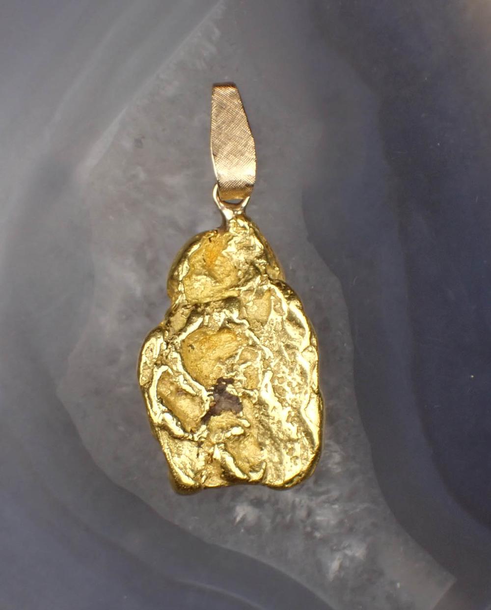 TWENTY ONE KARAT GOLD NUGGET