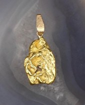 TWENTY ONE KARAT GOLD NUGGET P