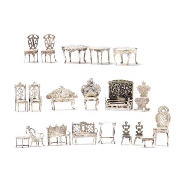 TWENTY SILVER MINIATURE MODELS OF