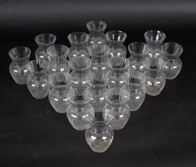 Twenty small glass posy vases