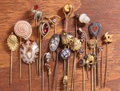 TWENTY-TWO ANTIQUE STICK PINS.