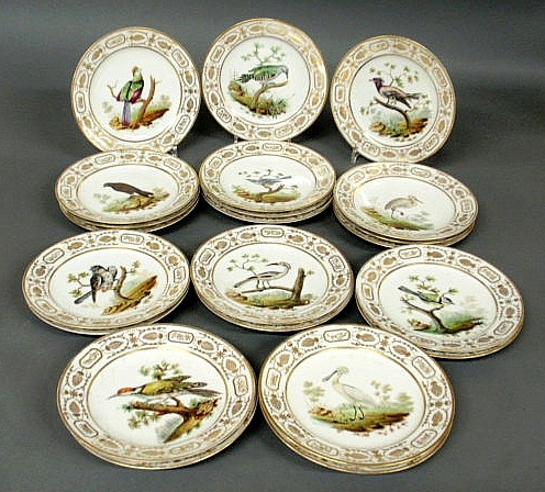 Twenty-two hand painted bird plates