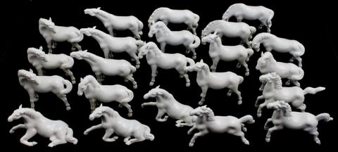 TWENTY-TWO WHITE PORCELAIN HORSES