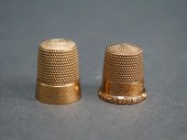 TWO 14-KARAT YELLOW GOLD THIMB