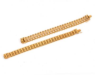 Two 18k gold bracelets, each marked