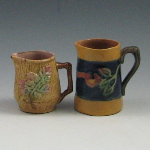 Two (2) Majolica Creamers left is