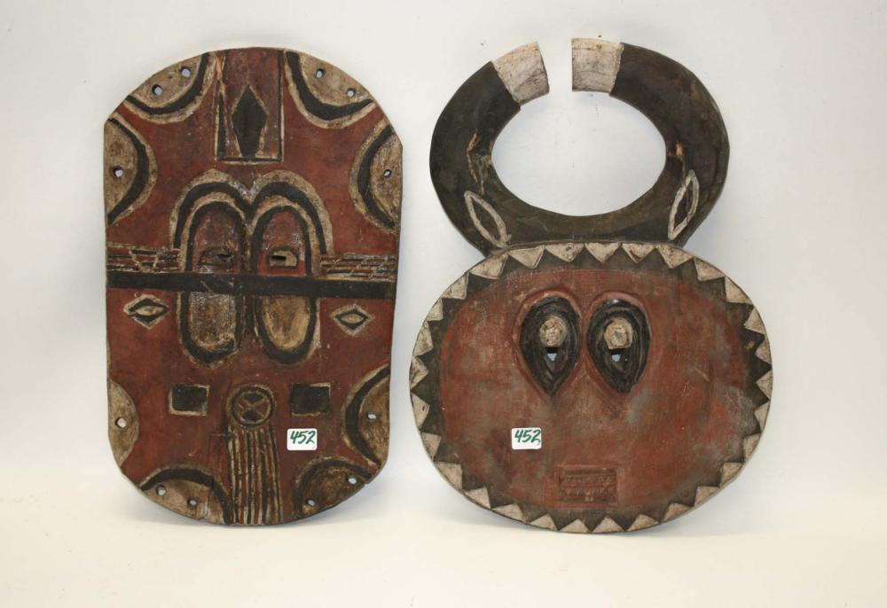 TWO AFRICAN CARVED AND PIGMENTED