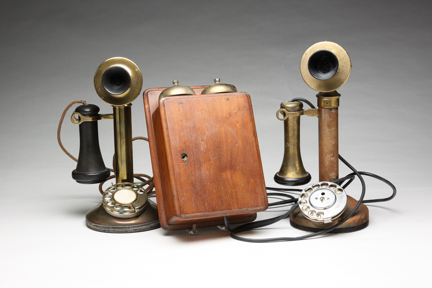 TWO AMERICAN CANDLESTICK PHONES.