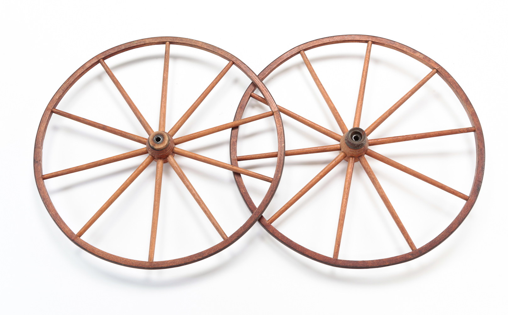 TWO AMERICAN GOAT CART WHEELS.