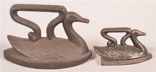 TWO ANTIQUE CAST IRON SWAN FLAT