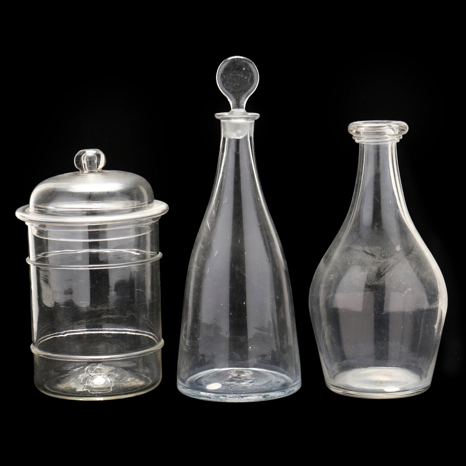 TWO ANTIQUE GLASS DECANTERS AND