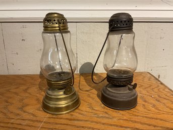 Two antique metal and glass skaters