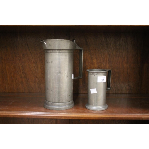 Two antique pewter measures, one