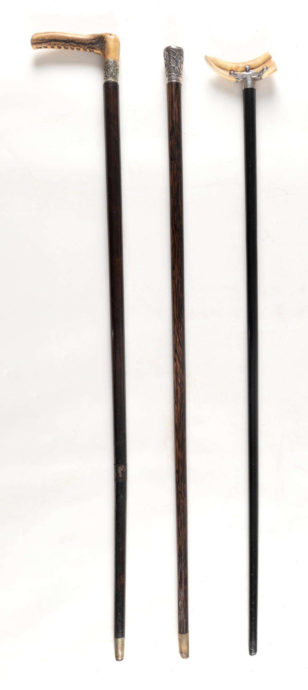 TWO ANTIQUE WALKING STICKS AND A