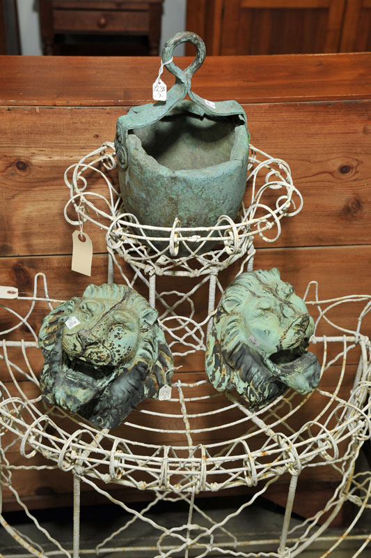 TWO ARCHITECTURAL LIONS AND A PAIL.