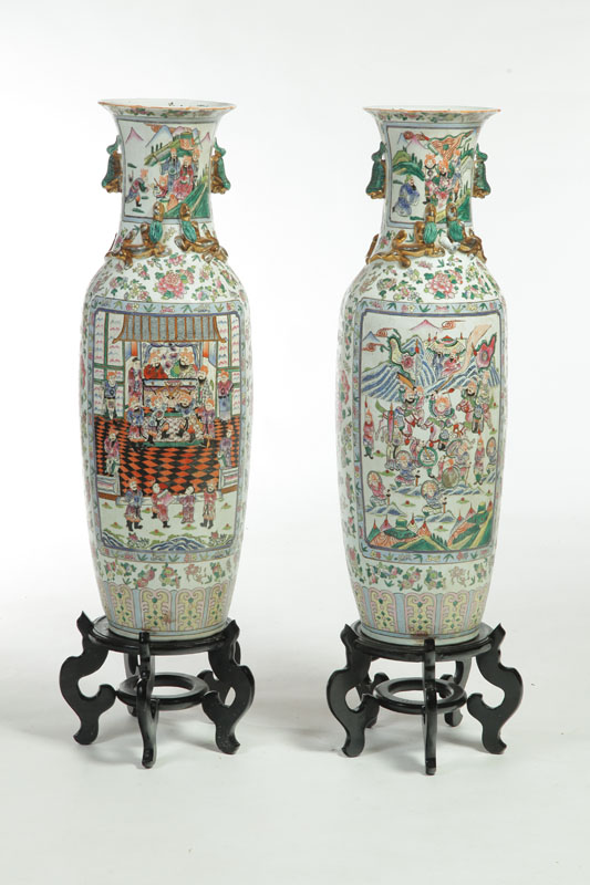 TWO ARMCHAIRS AND A PAIR OF VASES.