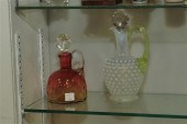 TWO ART GLASS CRUETS. An amber