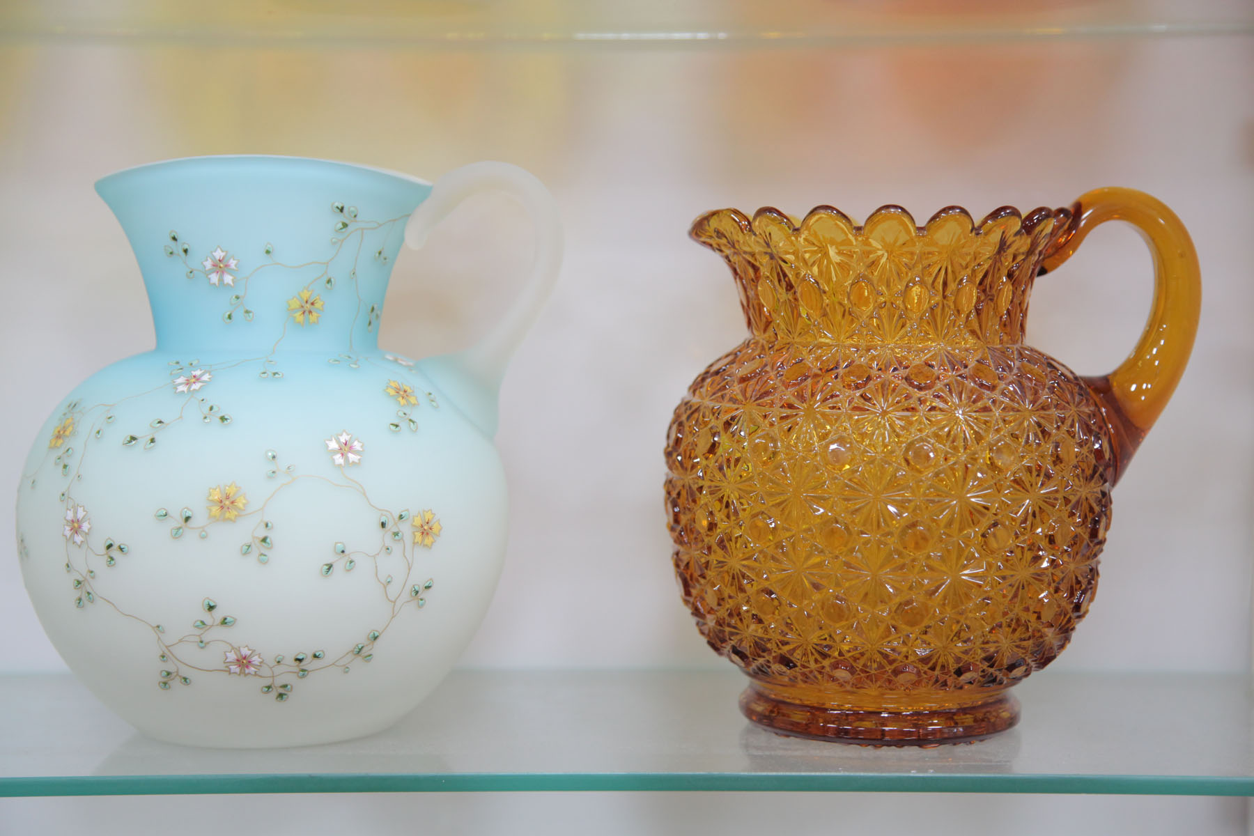 TWO ART GLASS PITCHERS. 
