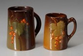 Two art pottery tankards: one