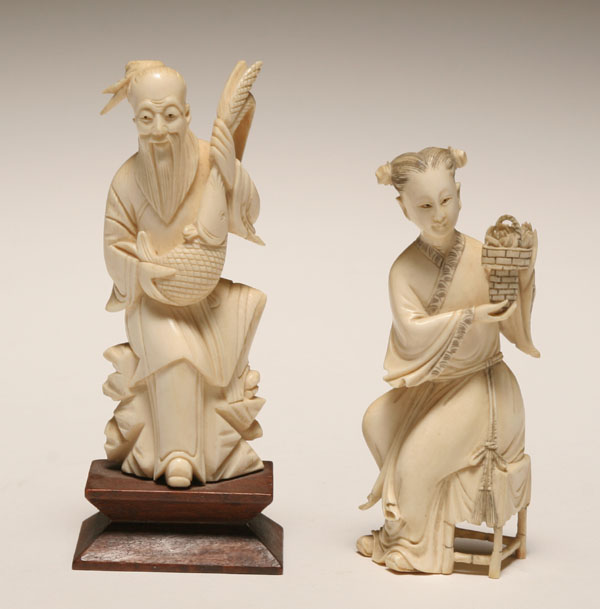 Two Asian carved ivory figures of a