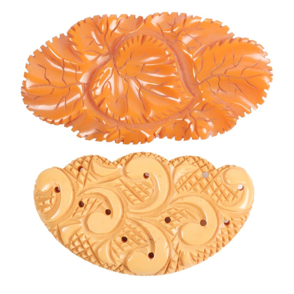 TWO BAKELITE PINS, CREAM AND