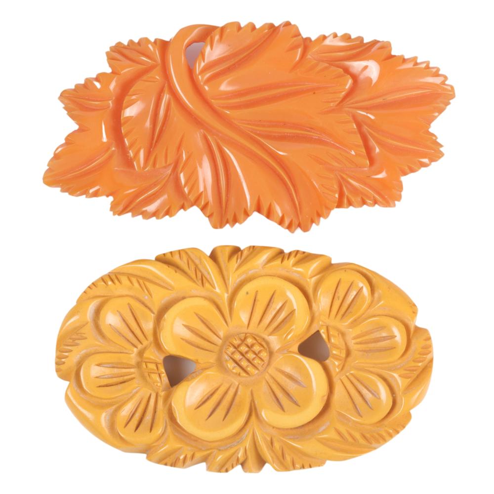 TWO BAKELITE PINS, CREAM AND