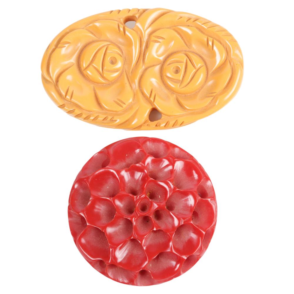 TWO BAKELITE PINS, CREAM AND RED