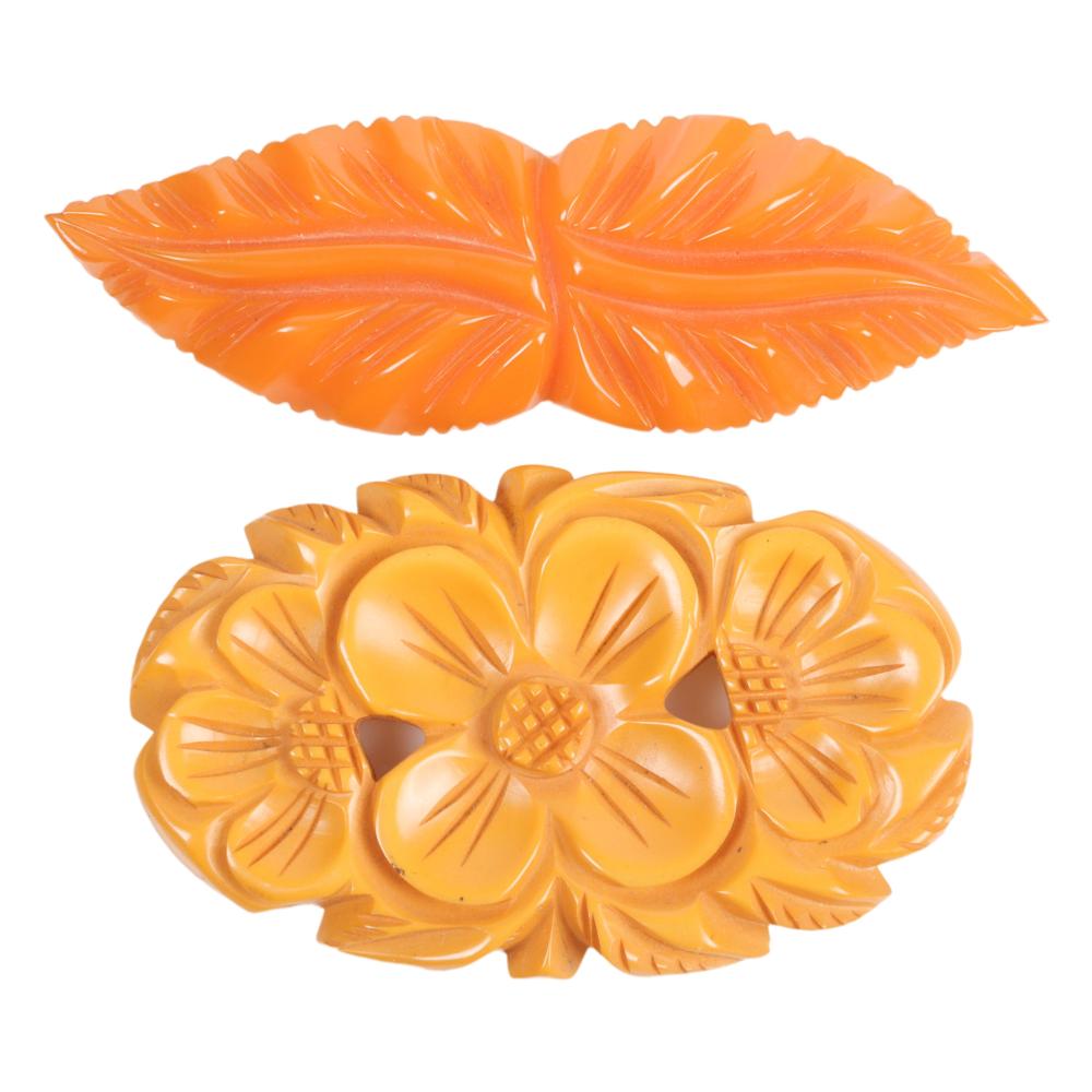 TWO BAKELITE PINS, LEAVES AND