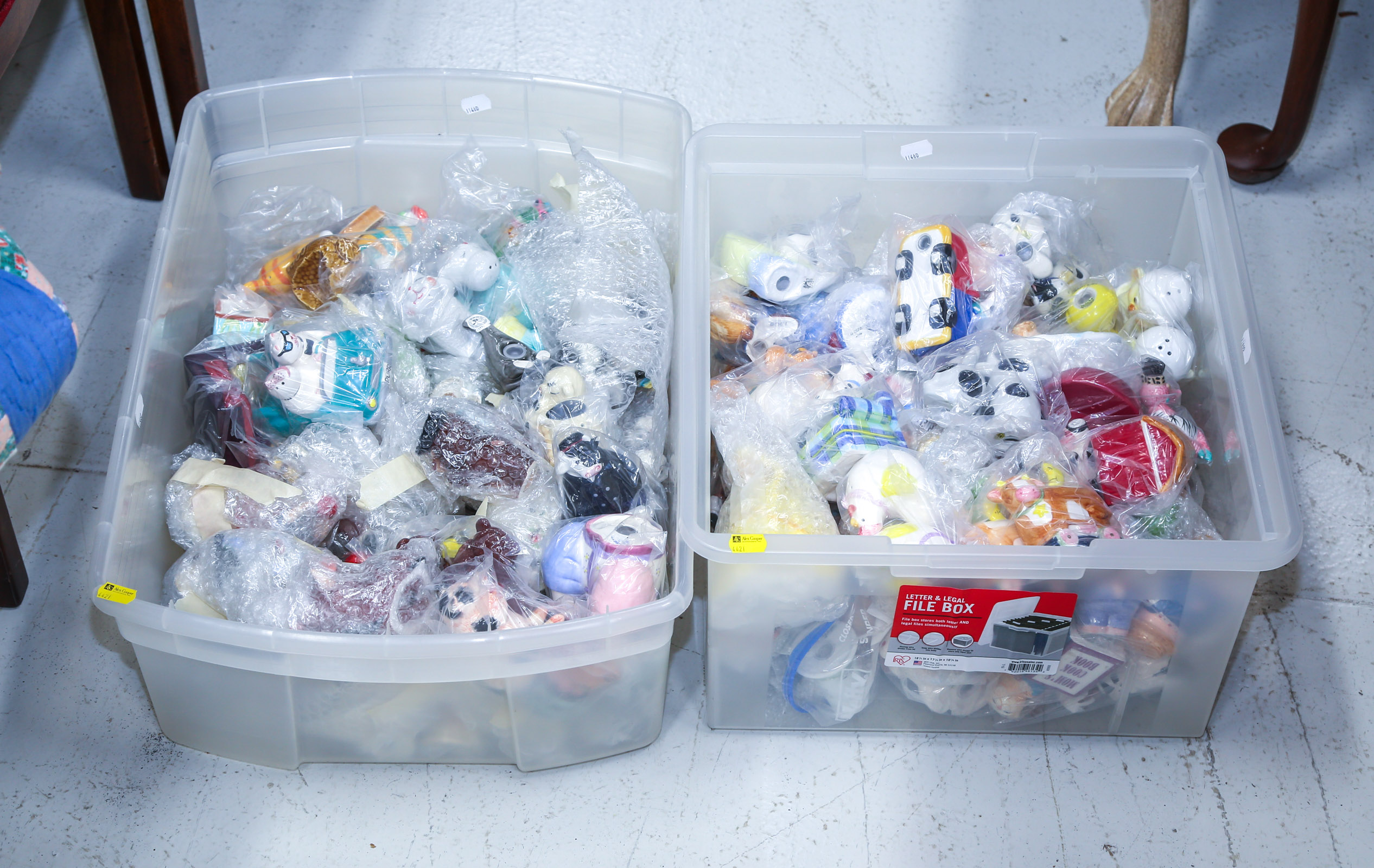 TWO BINS OF SALT & PEPPER SHAKERS .