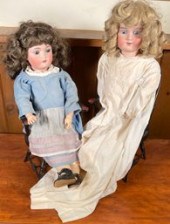 Two bisque head dolls in match