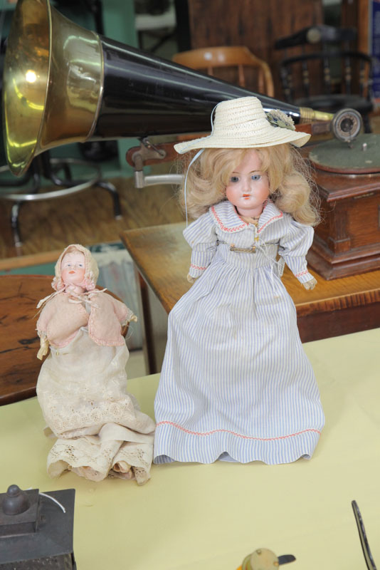 TWO BISQUE HEAD DOLLS. One with
