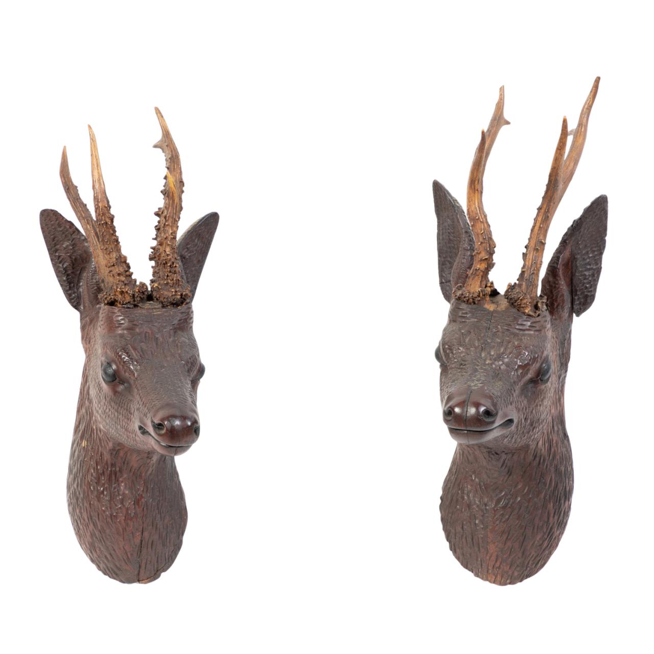 TWO BLACK FOREST WOODEN DEER'S HEAD