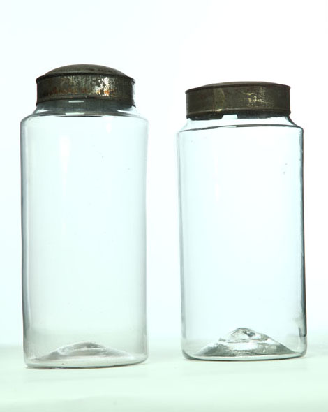 TWO BLOWN GLASS CANISTERS. 