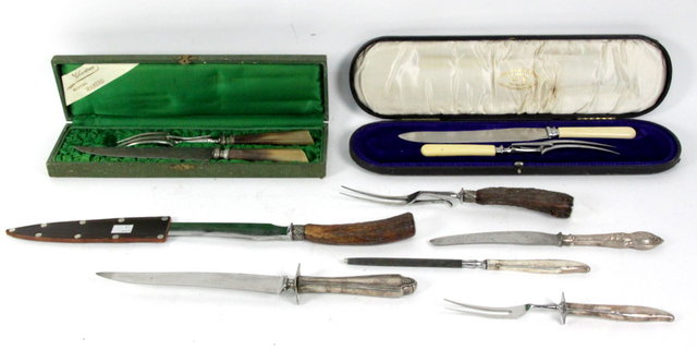 Two boxed carving sets and a